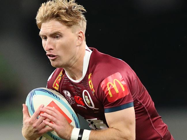 MELBOURNE, AUSTRALIA - MARCH 25: Tate McDermott of the Reds runs with the ball during the round five Super Rugby Pacific match between Melbourne Rebels and Queensland Reds at AAMI Park, on March 25, 2023, in Melbourne, Australia. (Photo by Kelly Defina/Getty Images)