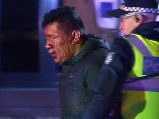 Screengrab showing a man injured during a brawl on Collingwood Street, Collingwood, Melbourne. 7News