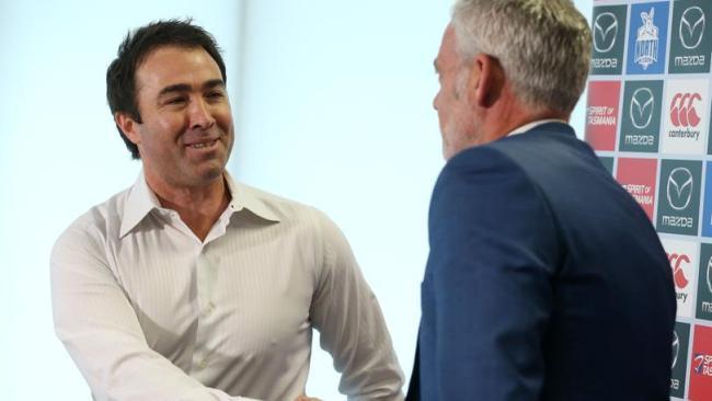 Outgoing North Melbourne coach Brad Scott shakes hands with chairman Ben Buckley after Sunday's press conference. Picture: Michael Klein