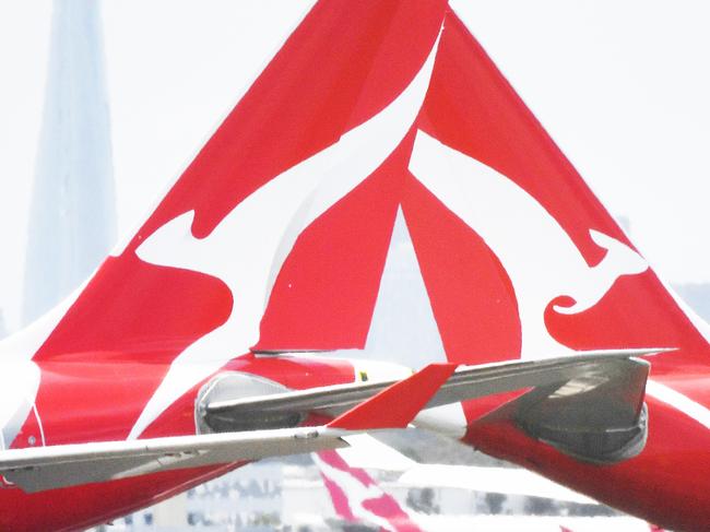 Qantas aircraft are seen at Sydney Airport, Thursday, 24 December 2020. Authorities are urgently investigating how a Qantas crew member contracted Covid-19 after arriving in Darwin from Paris and then flying to Sydney without being tested or quarantined. Federal health authorities are working with Qantas to understand how the man, who landed in Darwin on 17 December after working on a repatriation flight from Paris, became infected. Picture - Sam Mooy/The Australian Newspaperescape january 17 2021doc holiday