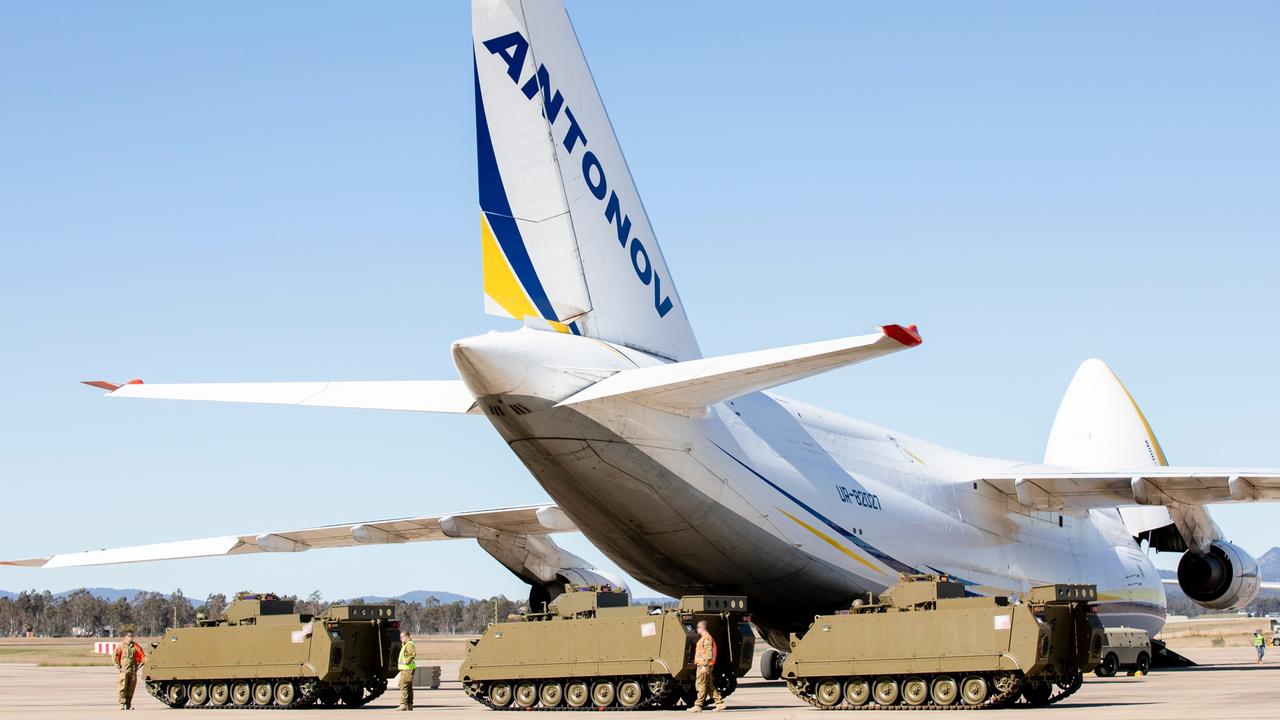 Australian Army M113AS4 Armoured Personnel Carriers bound for Ukraine, wait to be loaded onto an Antonov An-124 cargo aircraft at RAAF Base Amberley, Queensland.