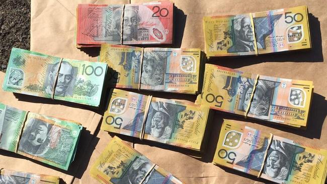 Some of the cash allegedly seized by police during raids on Monday and Tuesday. Picture: NSW Police Media