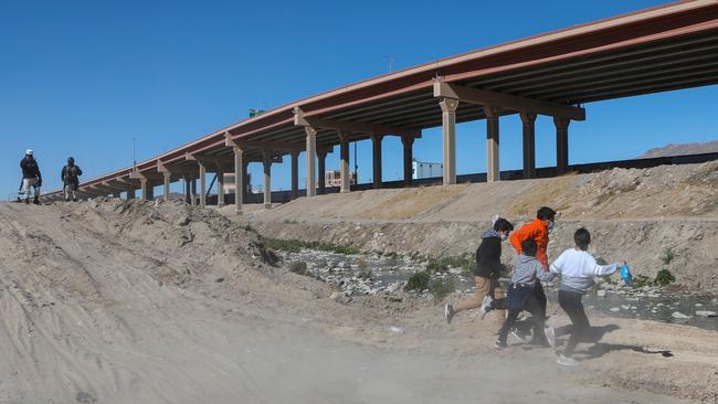 Migrants cross the Rio Bravo to get to El Paso, in Texas. Picture: AFP