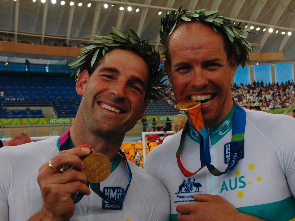 Kieran Modra and his pilot Robert Crowe after winning Australia's first gold medal of the Athens Paralympics. Picture: Jordan Baker/AAP Image