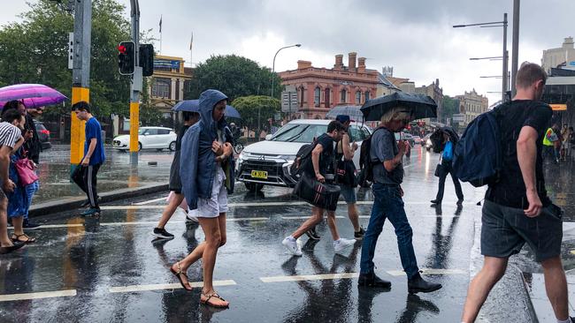 Rain falling at Newtown, Sydney on Christmas Eve. Picture: Nicholas Eagar