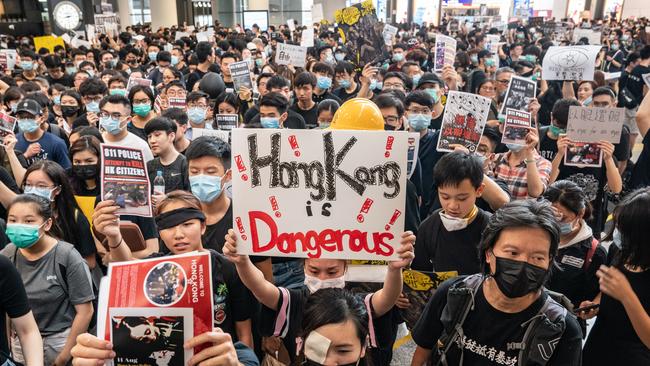 Protesters occupy the arrival hall of the Hong Kong International Airport. Picture: Getty