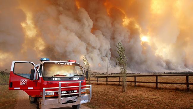 A Country Fire Authority crew from the Tynong brigade monitor a giant fire raging in the Bunyip State Park near Labertouche in February 2009. Picture: AFP