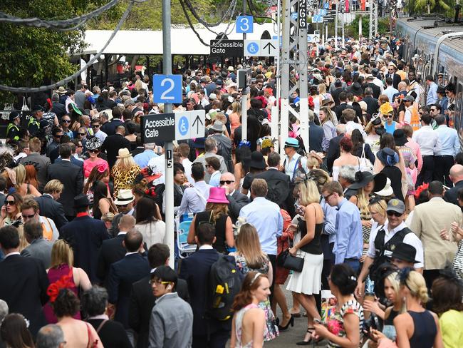 Thousands of race goers arrive to Flemington by train for the 2014 Melbourne Cup. Picture: Jake Nowakowski