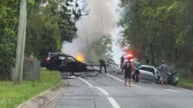 A car on fire after a fatal crash at Bonogin.