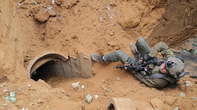 A soldier keeps guard over a tunnel shaft discovered by the IDF near the Israeli border. Picture: Yoni Bashan / The Australian