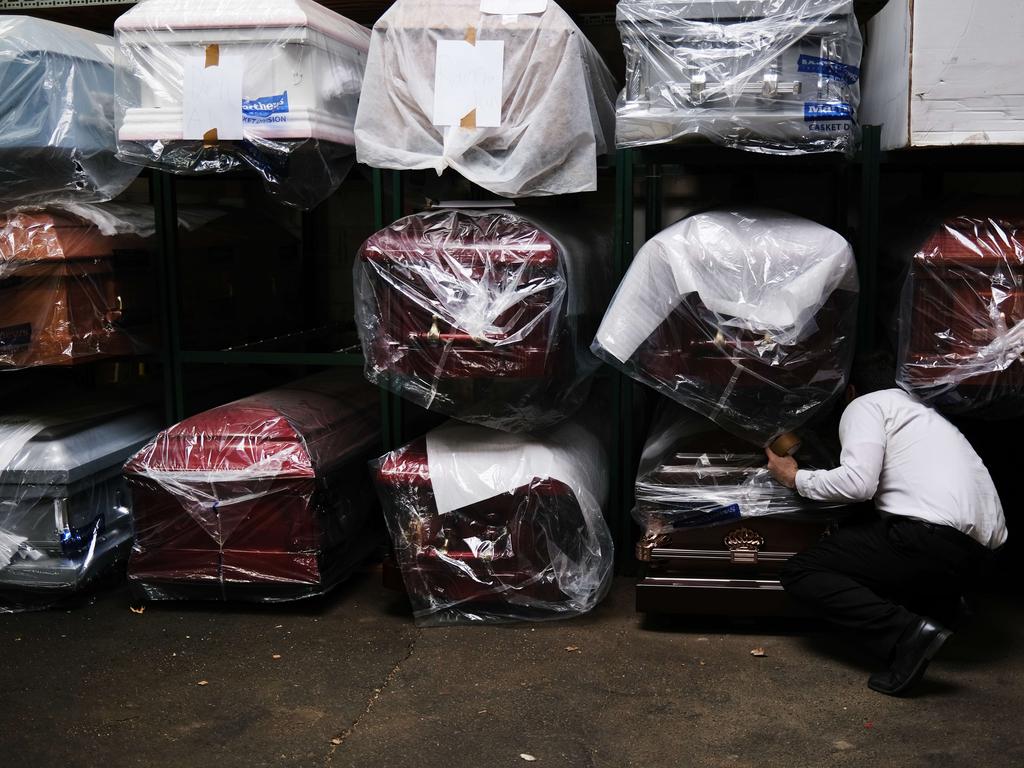 James Harvey tends to the caskets at a funeral home on April 29, 2020 in New York City. Picture: Spencer Platt/Getty Images/AFP