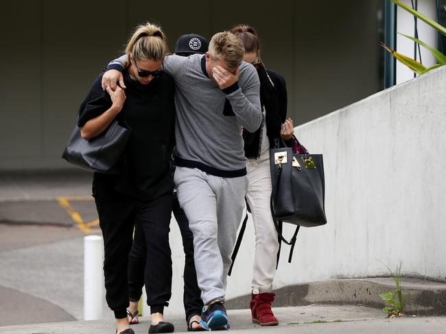 David Warner and wife Candice Falzon leave St Vincent's Hospital.