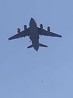 Desperate Afghans clung to the side of a moving US military plane leaving Kabul airport, with at least two falling to their deaths from the undercarriage immediately after takeoff.