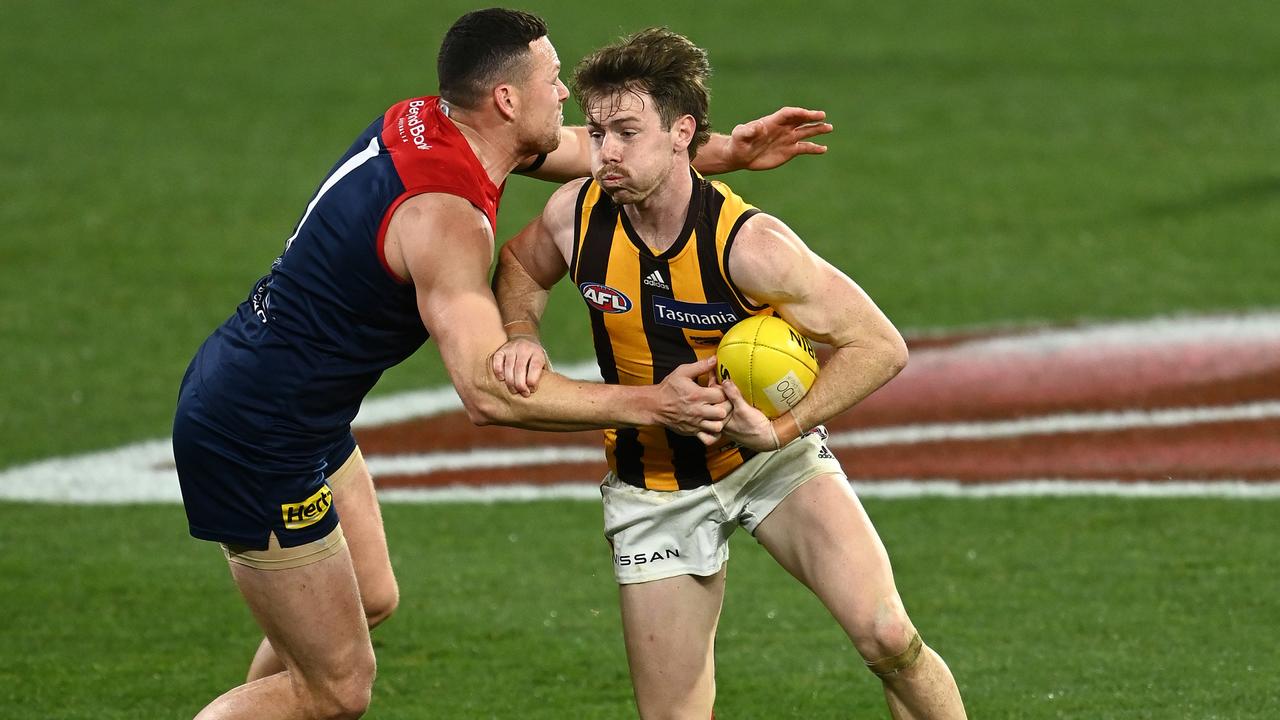 Lachie Bramble brushes off a tackle from Steven May.