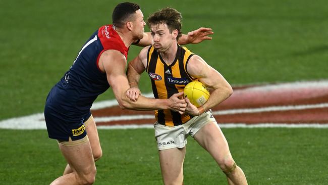 Lachie Bramble brushes off a tackle from Steven May.