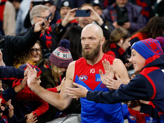 Max Gawn leads the Demons onto the field on Thursday night. Picture: Dylan Burns/AFL Photos via Getty Images.