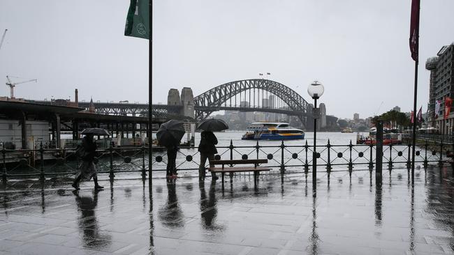 Sydneysiders in the wet last weekend. Picture: Gaye Gerard