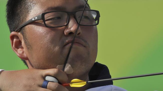 South Korea's Kim Woo-jin releases the arrow during the men's team archery competition in Rio.