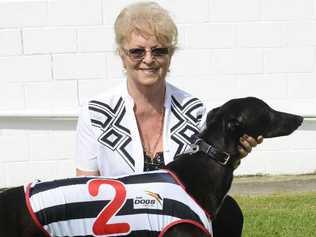 SALUTE: Dianne Hannon with her winning dog in race one, Billy’s Shadow. Photo: Adam Hourigan