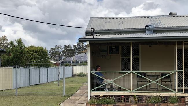 Mr Dore sitting in front of his house in Abermain.