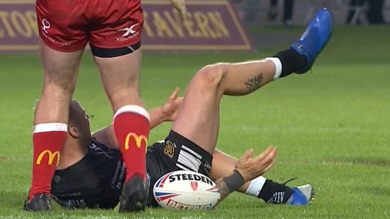 Hull FC player Joe Westerman knocks his kneecap back into place before playing on.