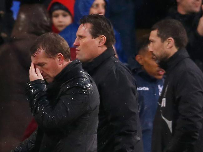 LONDON, ENGLAND - NOVEMBER 23: Brendan Rodgers, manager of Liverpool walks to the dressing room with Neil Warnock, manager of Crystal Palace after the Barclays Premier League match between Crystal Palace and Liverpool at Selhurst Park on November 23, 2014 in London, England. (Photo by Steve Bardens/Getty Images)