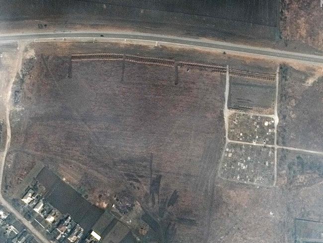 Satellite image shows a cemetery and early expansion of graves site in Manhush, about 20 kilometres west of Mariupol. Picture: AFP.