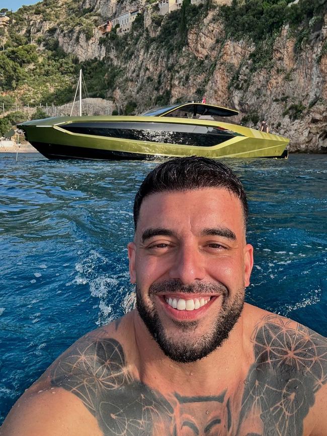 Swimming near his custom-made Lamborghini boat.