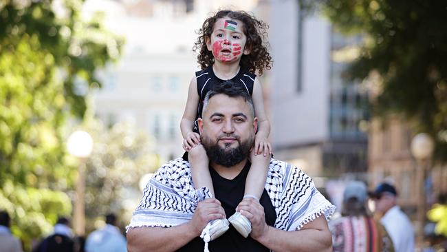 Ali Hijazi (3) with his dad Mahmoud Hijazi at the Pro-Palestine Protest in Hyde Park. Picture: Adam Yip