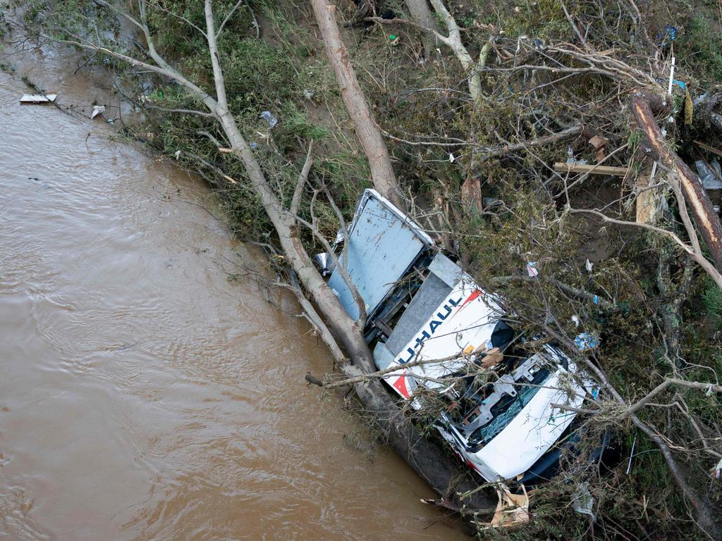 A storm-damaged U-Haul truck in a flooded waterway in the aftermath of Hurricane Helene in Asheville, North Carolina. Picture: Getty Images via AFP