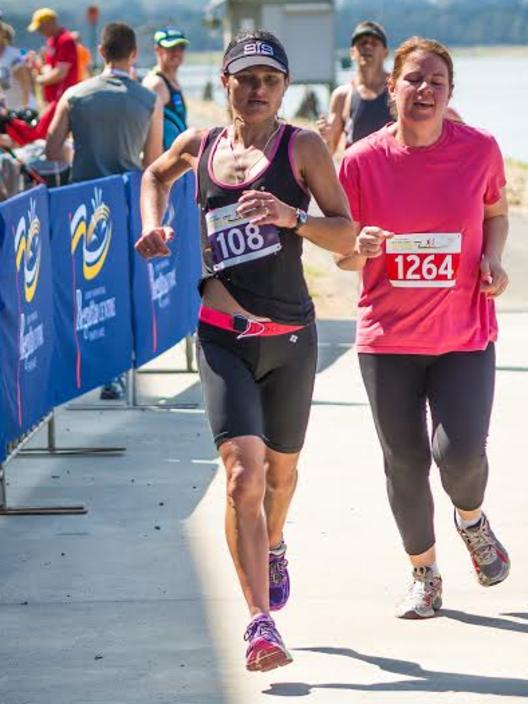 Western Sydney Marathon female winner Heidi Rickard crosses the finish line. (Photo: JGRimages)