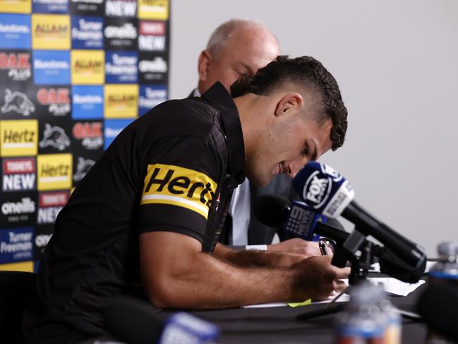 Nathan Cleary puts pen to paper on the new deal at the Panthers. Picture: Jonathan Ng