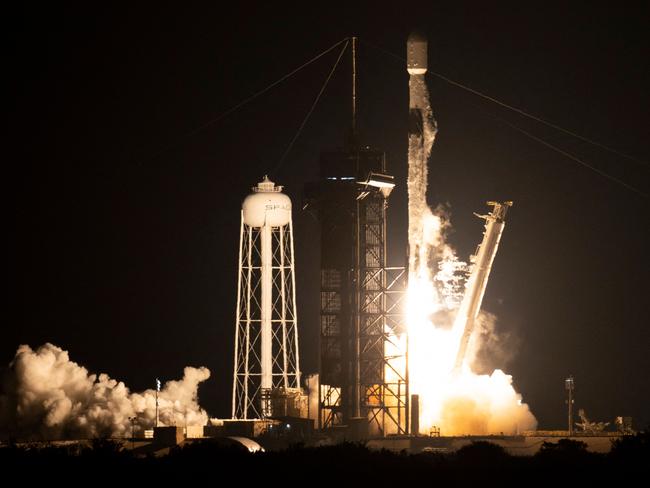 This NASA handout image shows a SpaceX Falcon 9 rocket launching with NASA's Imaging X-ray Polarimetry Explorer (IXPE) spacecraft onboard from Launch Complex 39A, December 9, 2021, at NASA's Kennedy Space Center in Florida. - The IXPE spacecraft is the first satellite dedicated to measuring the polarization of X-rays from a variety of cosmic sources, such as black holes and neutron stars. Launch occurred at 1:00 a.m. EST. (Photo by Joel KOWSKY / NASA / AFP) / RESTRICTED TO EDITORIAL USE - MANDATORY CREDIT 