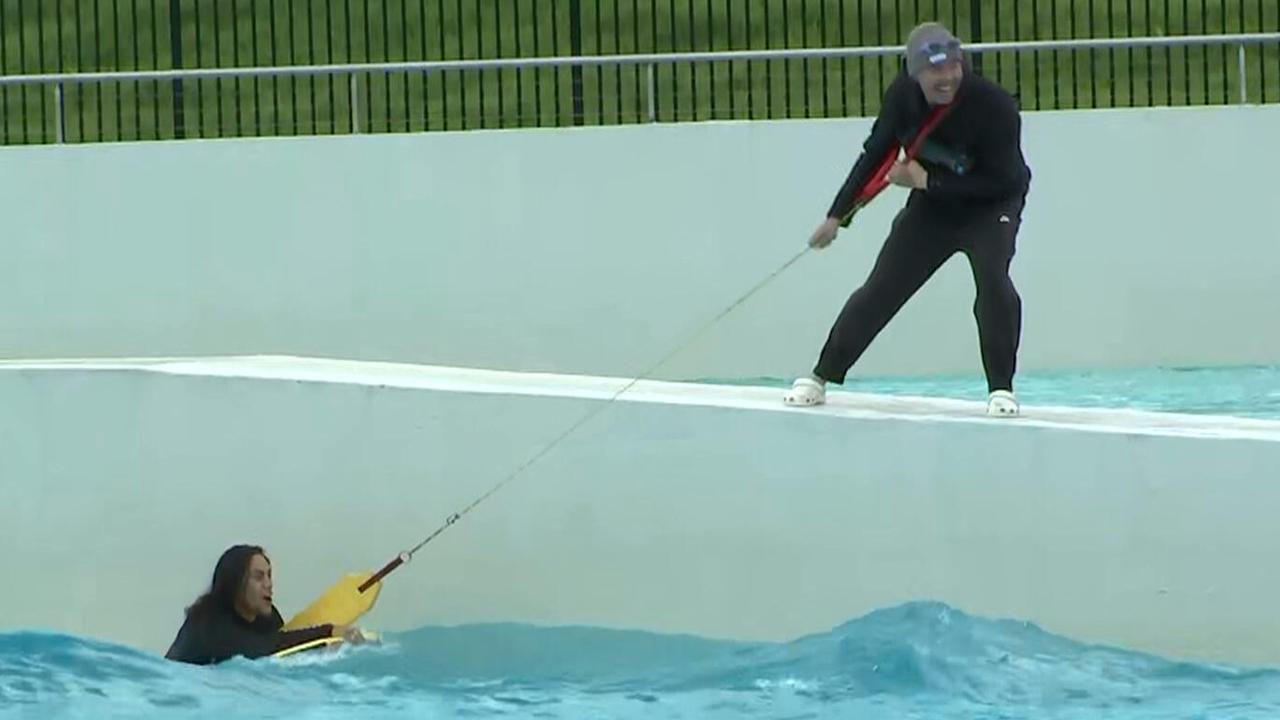 Jarome Luai is assisted from a wave pool on Tuesday morning.