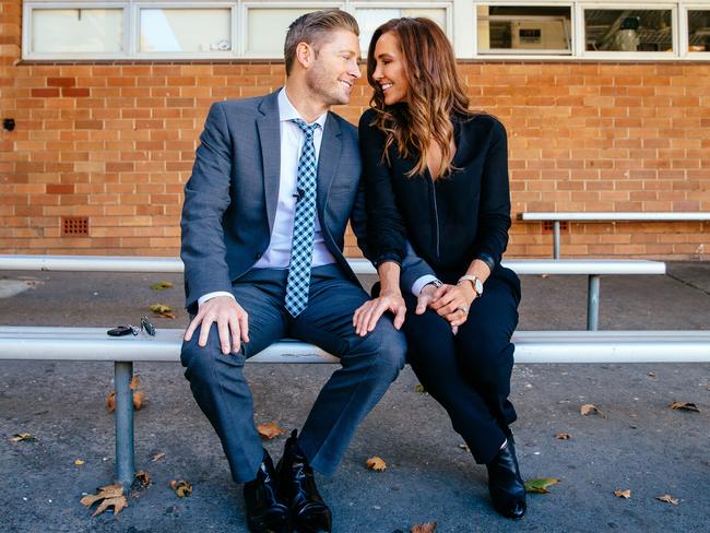 Michael and Kyly Clarke sitting in the spot Michael used to spend lunch times with mates at their old high school, Westfield Sports High School, in Fairfield West. Picture: Jonathan Ng