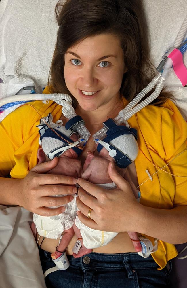 Sierra Olave with her premature identical twin daughters Evelyn (Evie) and Genevieve who were born at Mater Hospital at 23 weeks and one day gestation in November 2020. Pictured is Sierra's first cuddle of both twins almost a month after they were born.