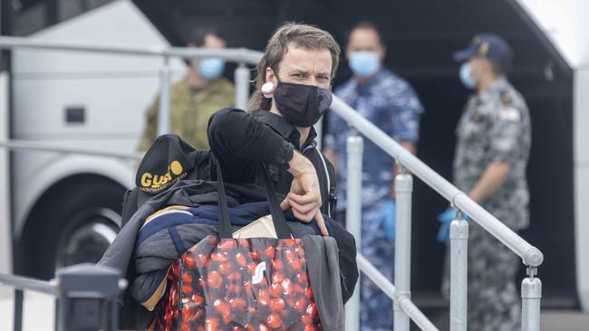 A passenger arrives from overseas at Sydney International airport this month. Picture: Jenny Evans