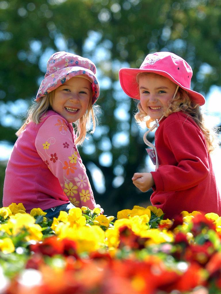 Carnival of Flowers – Darling Heights primary school students Chloe Watson and Madison Flack, both 5, enjoying the floral garden at Laurel Bank Park, Toowoomba. Pic: David Martinelli.