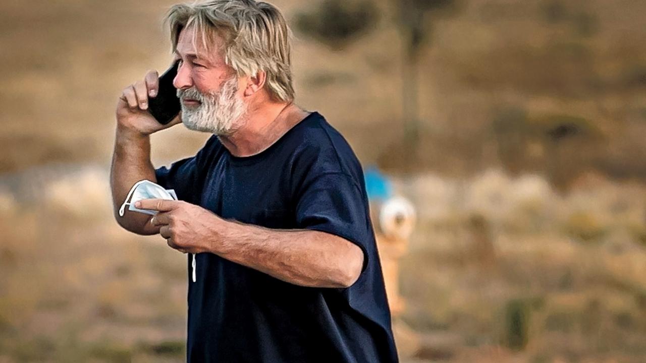 A distraught Alec Baldwin lingers in the parking lot outside the Santa Fe County Sheriff's offices after being questioned about a shooting on a movie set. Picture: Jim Weber/Santa Fe New Mexican