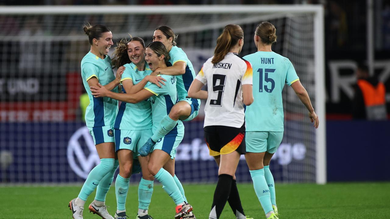 Kyra Cooney-Cross of Australia celebrates scoring her team's first goal with teammates during the women's international friendly match between Germany and Australia. Picture: Alex Grimm/Getty Images