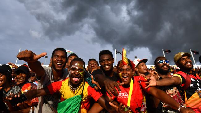 Papua New Guinea supporters celebrate their team’s win over Wales at the National Football Stadium in Port Moresby.