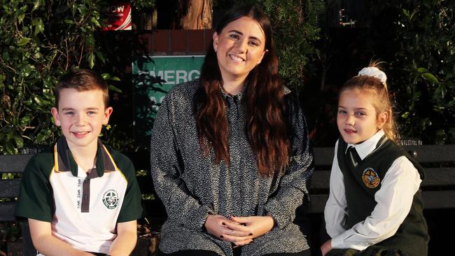 St. Philip’s Christian College teacher Beth Knaus with students Josiah Wilk, 10, (left) and Geneva Wellham, 7. Picture: Peter Lorimer