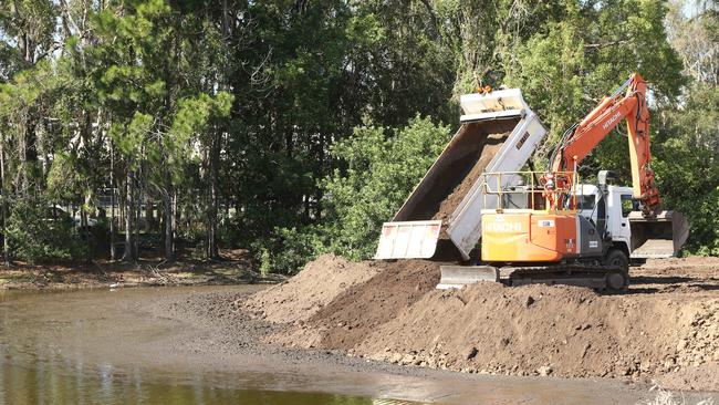 Black Swan Lake slowly being filled in by workmen at Bundall. Picture: Glenn Hampson