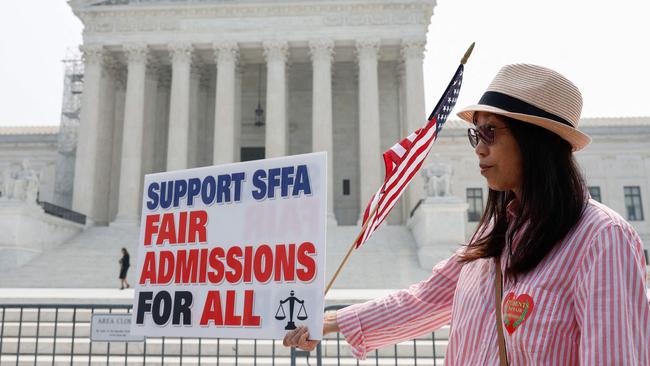 WASHINGTON, DC - JUNE 29: Anti-affirmative action activists with the Asian American Coalition for Education protest outside the U.S. Supreme Court Building on June 29, 2023 in Washington, DC. In a 6-3 vote, Supreme Court Justices ruled that race-conscious admissions programs at Harvard and the University of North Carolina are unconstitutional, setting precedent for affirmative action in other universities and colleges.   Anna Moneymaker/Getty Images/AFP (Photo by Anna Moneymaker / GETTY IMAGES NORTH AMERICA / Getty Images via AFP)