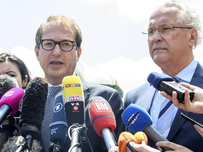 German Minister of transport Alexander Dobrindt, left, and Bavarian minister of the interior, Joachim Herrmann, right, said relatives of the dead had still not been notified. Picture: Matthias Balk/dpa via AP