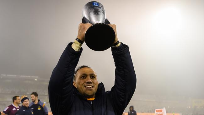 Brumbies captain Christian Lealiifano lifts the Australian Conference trophy.