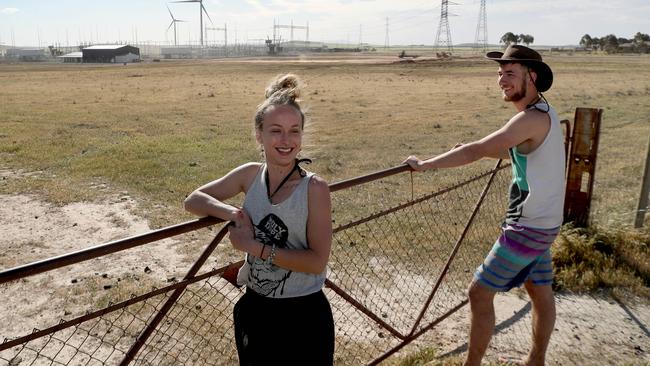 Stepahine Nedosko from Adelaide and David Dubois from Switzerland near where the Tesla battery and substation will be built near Jamestown. Picture: Kelly Barnes