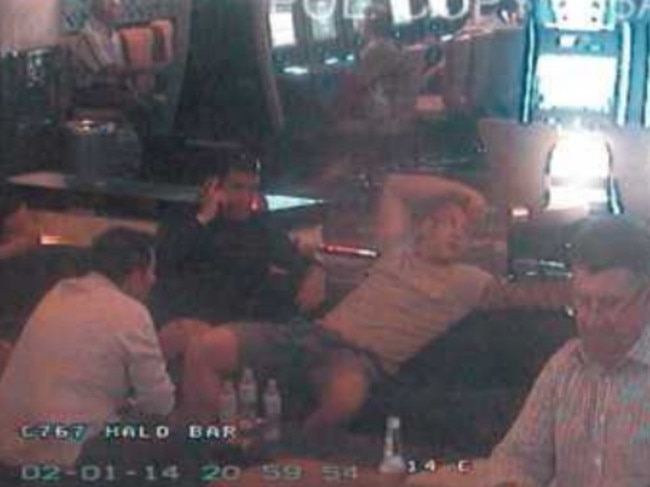 Caught on CCTV, Pasquale Barbaro (centre, right arm on head) lounges in the Star Casino.