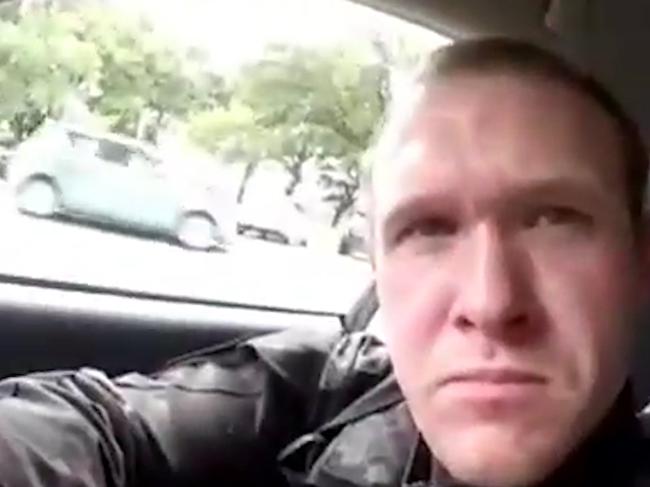 This frame from the video that was live-streamed Friday, March 15, 2019, shows a gunman, who used the name Brenton Tarrant on social media, in a car before the mosque shootings in Christchurch, New Zealand. Those who watched Brenton Tarrant growing up in the sleepy Australian country town of Grafton apparently had no inkling of the evil potential that he allegedly unleashed in merciless gunfire in two New Zealand mosques that claimed at least 49 lives. (Shooter's Video via AP)