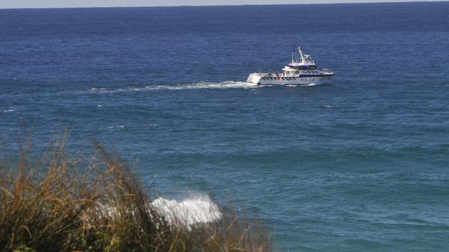 A police boat surveys waters the day after the man was bitten by a shark. Photo: Tim Jarrett / Coffs Coast Advocate